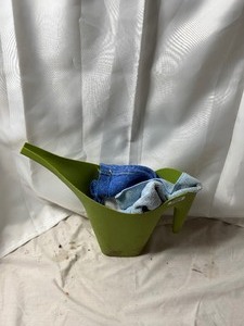 lot 2141 image: Green plastic watering can with towels