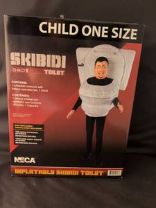 lot 26 image: NIB NECA Inflatable Skibidi Toilet Child One Size Costume with Battery-Operated Fan
