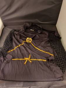 lot 30 image: Black Costume with Gold Skull Design and Mesh Sleeves