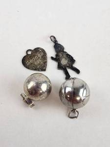lot 131 image: 4 Vintage Sterling Charms Pendants Heart Doll Ball
