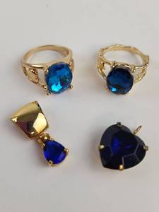 lot 201 image: Gold Tone Blue Stone Rings and Pendant 4-Piece Lot
