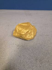lot 2127 image: Gold Nugget Stress Reliever - Retail $9