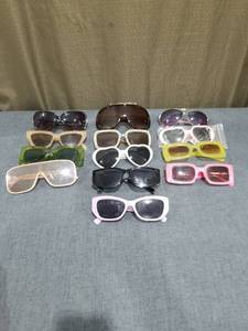 lot 1027 image: Lot of 13Assorted Sunglasses with Various Frame Styles and Lens Colors