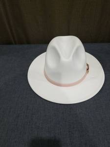 lot 1030 image: White Cowboy Hat with Pink Band and Gold Buckle