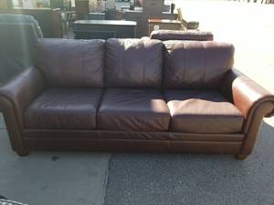 lot 34 image: Ethan Allen Brown Three-Cushion Sofa with Rolled Arms