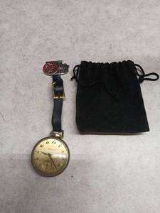 lot 3082 image: New Haven Compensated Pocket Watch with Film Reel Fob and Pouch