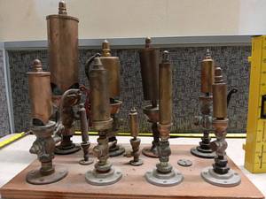 lot 3179 image: Buckeye Brass Whistles Collection 10 Pieces on Wood Base with Documentation