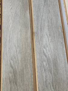lot 7 image: 17-Boxes of 12mm Wood Laminate Flooring (Approx. 285sf)