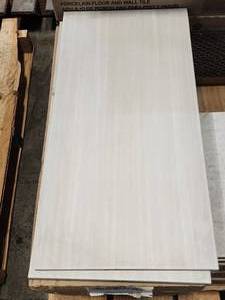 lot 37 image: 4-Boxes of 12x24 Light Gray Porcelain Tile (Approx. 62sf)