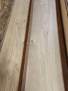 lot 50 image: 9-Boxes of 12mm Wood Laminate Flooring (Approx. 177sf)
