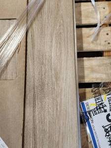 lot 63 image: 3-Boxes of 6x 36 Medium Dark Brown Wood Look Porcelain Tile (Approx. 39sf)