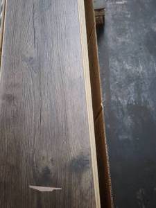 lot 84 image: 7-Boxes of 12mm Wood Laminate Flooring (Approx. 138sf)