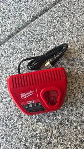 lot 105 image: Milwaukee M12 Battery Charger - Retail $0