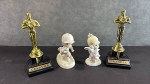 lot 1026 image: Worlds Greatest Grandma Oscar Award Trophy Figurines and Two Precious Moments Figurines