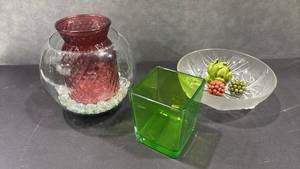lot 1040 image: Glass Drinkware Lot Red Pitcher Bowl, Green Cube Vase, Clear Plate Set