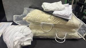 lot 1041 image: Two pillows, three pillowcases and a mattress cover