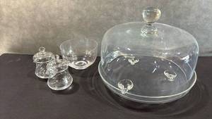 lot 1062 image: Glass Tableware Lot with Covered Cake Dome, Condiment Jars, and Bowl