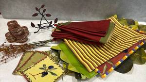 lot 1063 image: Decorative Napkins and Placemats Lot with Beaded Bracelets and Floral Picks