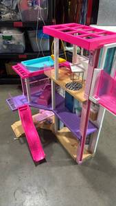 lot 1098 image: Barbie Multi-Story Playset with Furniture and Accessories. It has been glued together and comes in one piece.