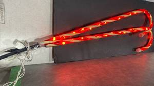 lot 2050 image: Outdoor lighted candy cane stakes