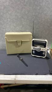 lot 2066 image: Eton Solarlink manual emergency radio with file box and black watch