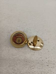 lot 12745 image: Kwikset 660 Bright Brass Deadbolt Model 5064905, 2 Pack