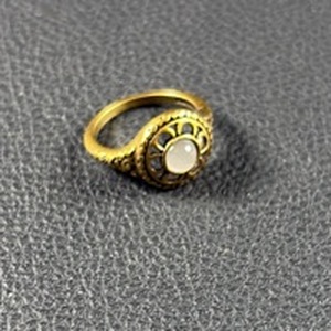 lot 3 image: Gold Tone Ring with White Moon Stone Center Approximate Size 5-6