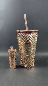 lot 30 image: New Starbucks Rose Gold Quilted Tumbler and Keychain