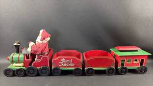 lot 112 image: Christmas Train Set 4-Piece Santa Engine Tender Coal Car Caboose