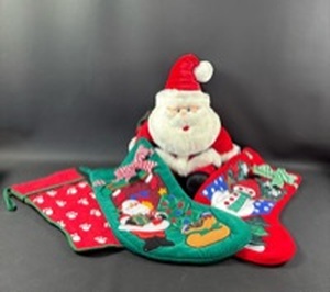lot 132 image: 3) Christmas Stockings and Santa Plush Toy (approximately 15 inches tall seated)