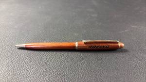 lot 146 image: Rosewood Twist Pen BOEING-laser-engraved on the barrel, commonly produced as a corporate or promotional gift by makers like BarlowSalm. (Will need refill)