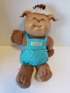 lot 303 image: Cabbage Patch Kids Doll with Turquoise Overalls