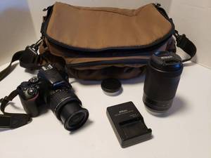 lot 324 image: Nikon D3500 DSLR Camera with AF-P 18-55mm and 70-300mm Lenses, Battery Charger, 32 GB Card and Nice Coleman Camera Bag