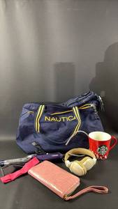 lot 173 image: Nautica Navy Duffel Bag with Wallet, Headphones, Starbucks Mug and Conair Curling Iron