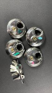 lot 405 image: U haul  Padlocks 4) with two Keys each (color coded)