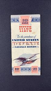 lot 438 image: 10 Cent Defense Stamp Album United States Defense Savings Bonds