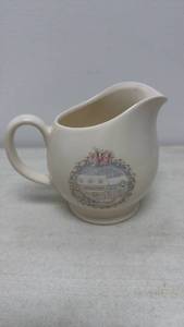 lot 12 image: Pfaltzgraff Ceramic Creamer Pitcher (General Store Scene)