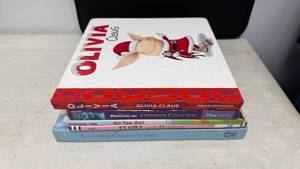 lot 107 image: Childrens Books Lot Olivia Claus, Monsters Inc, Go Van Go, Flora Flamingo, Little Christmas Tree (5 books)