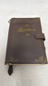 lot 128 image: Spellbook Leather-Bound Bifold Wallet with Snap Closure by ThinkGeek