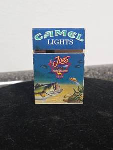 lot 289 image: VINTAGE Camel Lights Joes Fish & Game Club Cigarette Pack Lighter