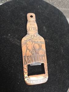 lot 294 image: Kentucky The Bluegrass State Bottle-Shape Bottle Opener Original Since 1792