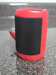lot 297 image: Portable Bluetooth Speaker Red Black Cylindrical