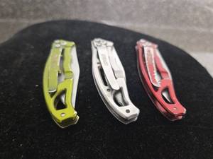 lot 321 image: Gerber Folding Pocket Knives 3-Piece Lot Yellow White Red
