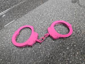 lot 340 image: Pink Metal Handcuffs. No key.