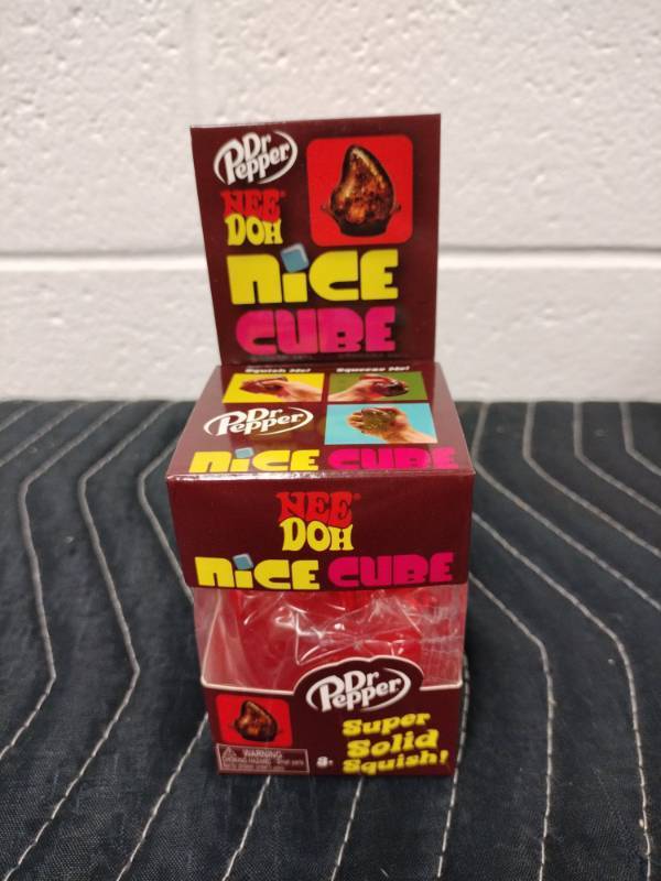 lot 61 image: Schylling NeeDoh Dr. Pepper Nice Cube Squishy Drop Super Solid Squish Toy