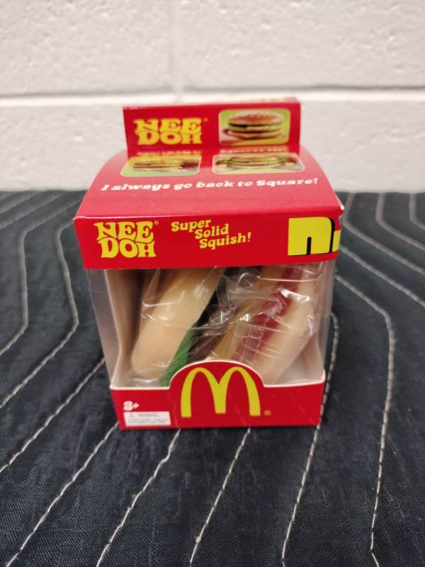 lot 74 image: NeeDoh McDonalds Big Mac Nice Cube Super Solid Squish Toy by Schylling