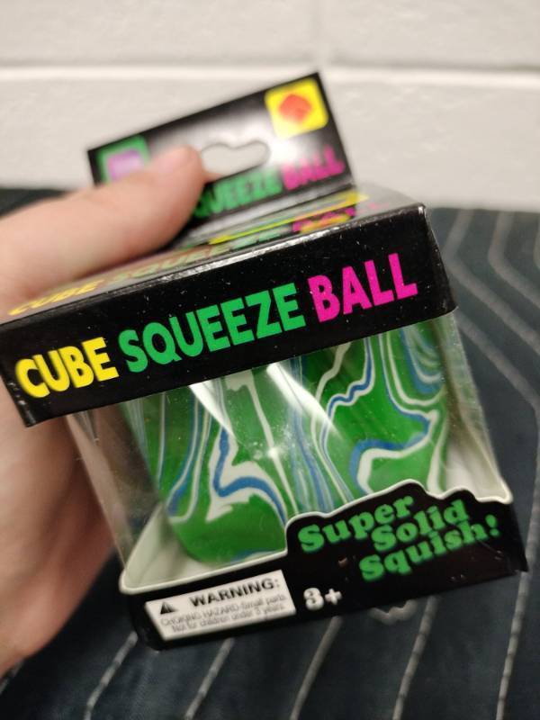 lot 124 image: Cube Squeeze Ball Super Solid Squish Green Marbled Squeeze Toy