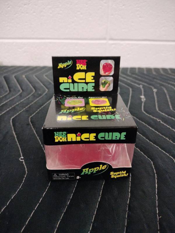 lot 154 image: NeeDoh Nice Cube Apple Squishy Toy Pink by Schylling