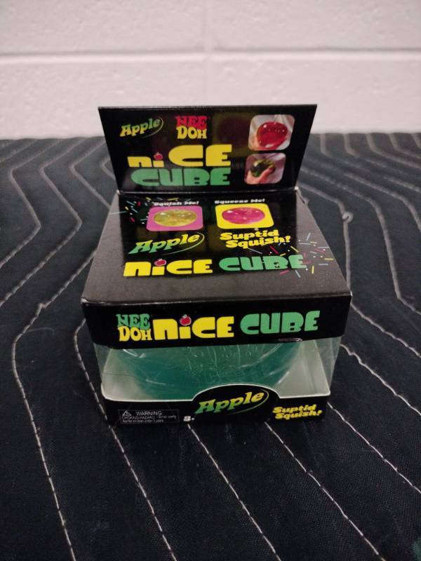 lot 156 image: NeeDoh Nice Cube Apple Squishy Toy Blue by Schylling