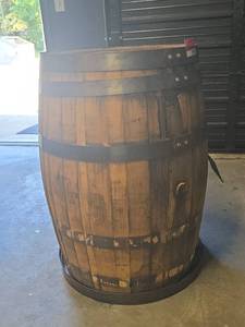 lot 21917 image: Used Oak Whiskey Barrel with Black Steel Hoops and Wooden Bung